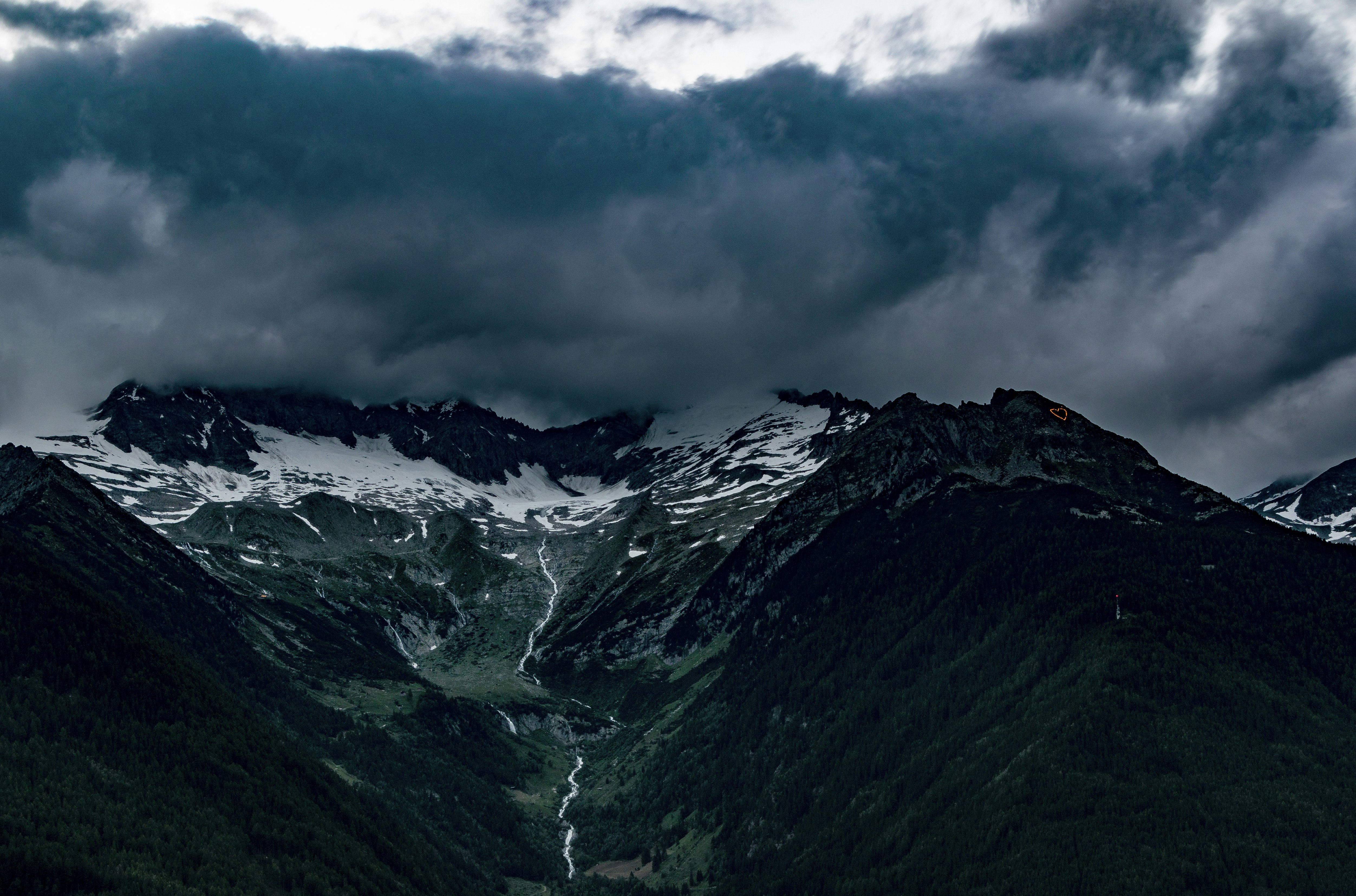 bird's-eye view photography of mountain range under cloudy sky